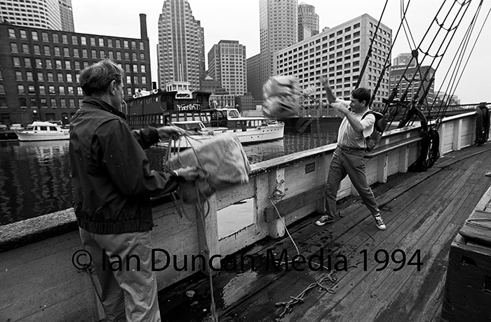 TEA OVERBOARD... Tourists get into the spirit of the times...
