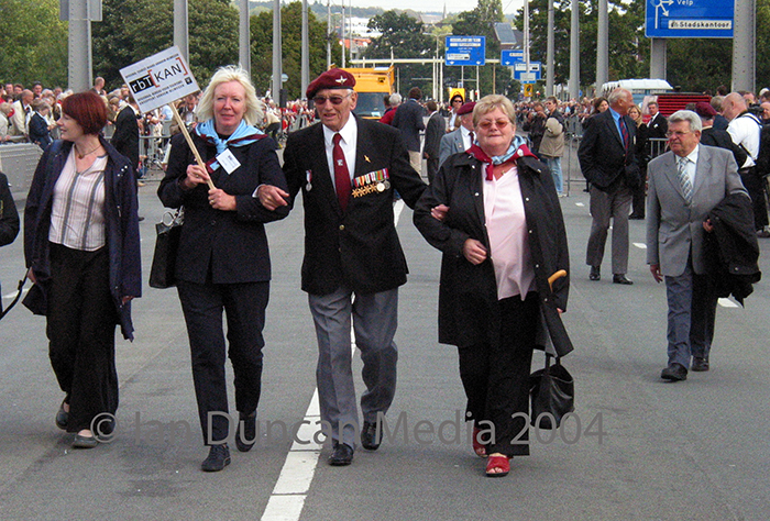 RETURN... Veteran Arthur Sobey walks towards the bridge in Arnhem...