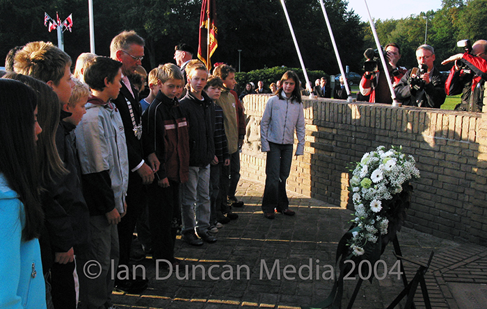 A NATION'S TRIBUTE... Mayor Piet Bruinooge and local schoolchildren lay a wreath at the Oosterbeek Airborne Memorial...