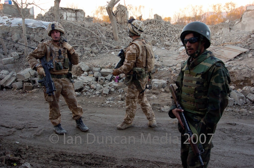 DAMAGE... Troops during a foot patrol of Muse Qala in Helmand province, Afghanistan, and this picture shows the destruction caused when the town was recently recaptured from the Taliban...