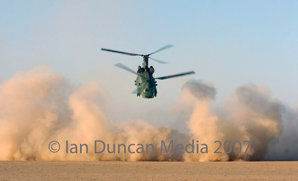 TAKE OFF... A Chinook helicopter takes off from FOB Edinburgh in Helmand province, Afghanistan, after dropping off supplies... The cloud of dust was known as a "brown out"...