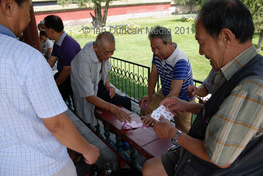 CARD GAME... Men at the Temple Of Heaven in Beijing in China...