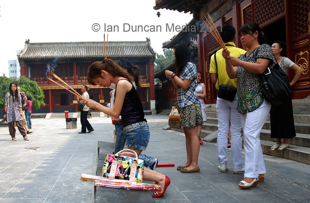 LAMA TEMPLE… Visitors praying in Beijing in China…