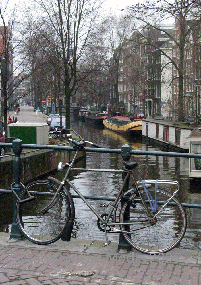 FAMILIAR SIGHT... A bicycle parked over a canal....