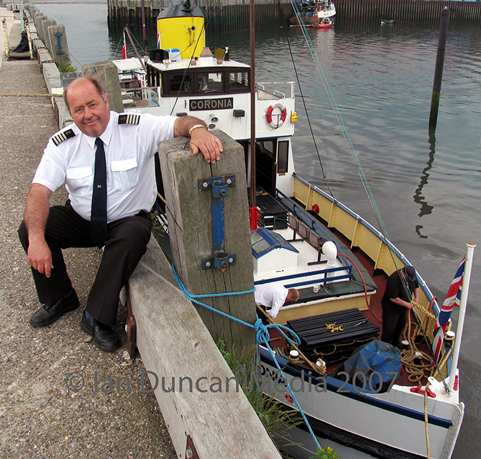Owner Tom Machin with the Coronia, which has undergone repairs to its hull...
