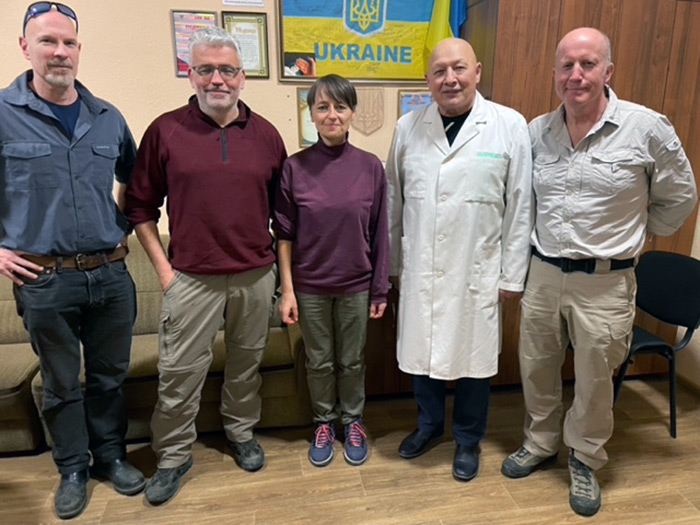BACK ON THE FRONTLINE... Andy Kent, far right, with medical staff in Ukraine during his last visit. He is now back in Ukraine...