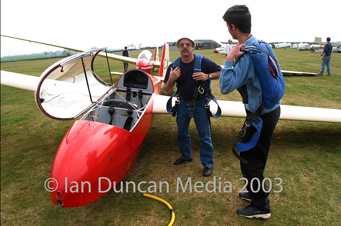 GLIDING CLUB... Club members get ready for take off...