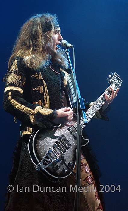 THE DARKNESS... Singer and guitarist Justin Hawkins on stage at the Sheffield arena...