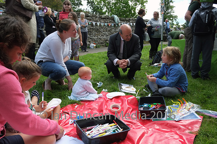 LOCALS... Defra minister, Lord Gardiner of Kimble, chats to residents...