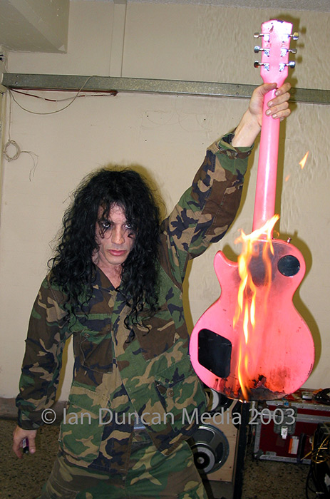 FLAMING GOOD... Adam bomb with his burning guitar...
