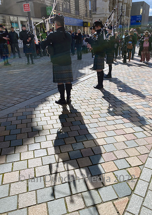 SHADOWS... The City of Inverness Youth Pipe Band in High Street today...