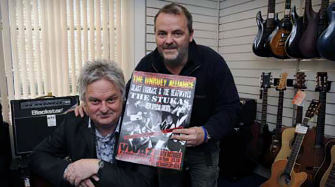 SUPPORT... Kevin Allen, left, with Phil Booth of Guitar Galleries. Phil has donated equipment and expertise for the gig...