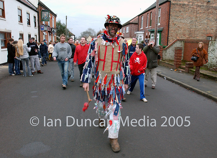 FOLLOWING THE FOOL... The Fool, Dale Smith, leads locals through the streets of Haxey...