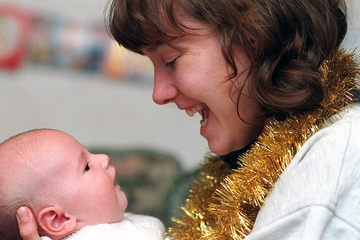 COMFORT AND JOY... Mum Amanda cuddles Bailey just six weeks after the knife attack...