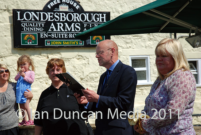 HORSE FAIR... John Senior reads out the fair charter...