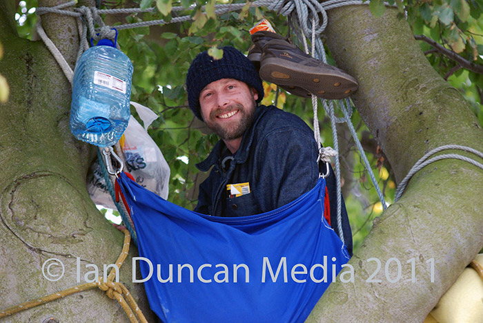 PROTEST... Mark “Snoz” Snow in the threatened historic beech tree in Irton...