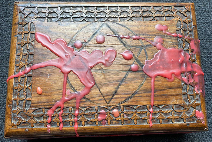 BOLSKINE BOX... The carved wooden box which is covered in melted wax...