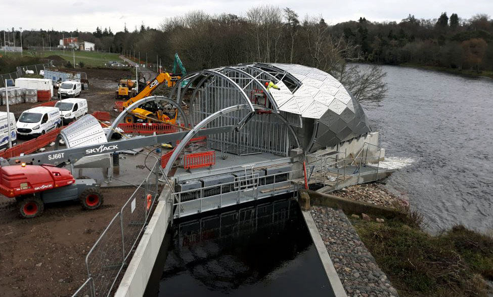 PROGRESS... The stainless steel envelope is added to the hydro project on the River Ness...