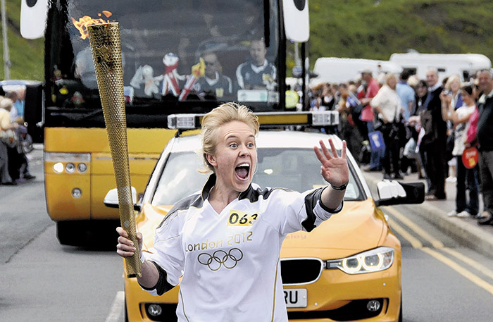 TORCHBEARER... Ellie Wallis carries the torch through her home town...