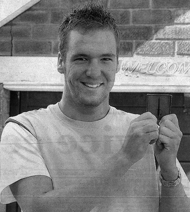 HONOUR... Andrew Melia with the commando patch awarded for his performance under fire...