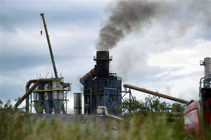BLAZE... Smoke pours from the former Norbord plant, at Dalcross, which is now part of West Fraser...