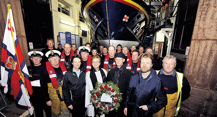 TRIBUTE... Front, from left, Ross Tyson, RNLI standard bearer, Tom Clark, coxswain, Lady Caroline Ffrench-Blake, Rev Pamela Jennings, John Beauclerk (great-grandson of Lord Charles Beauclerk), Charles Beauclerk (great-great grandson) and Tom Fox, tractor driver, with other members of the lifeboat crew behind, before the laying of a wreath from the main lifeboat in the South Bay, near the wrecks of the Schooner Coupland and Scarborough lifeboat Amelia...
