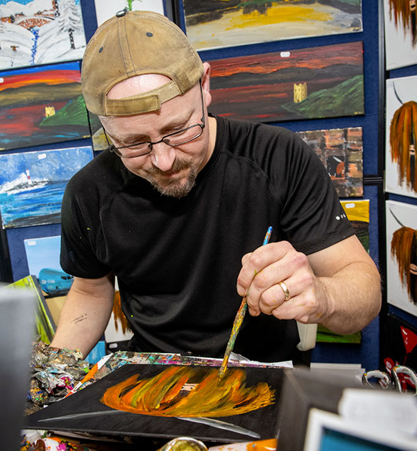 CREATION... Artist Jon Grant creates another painting at the Loch Ness Clansman Hotel...