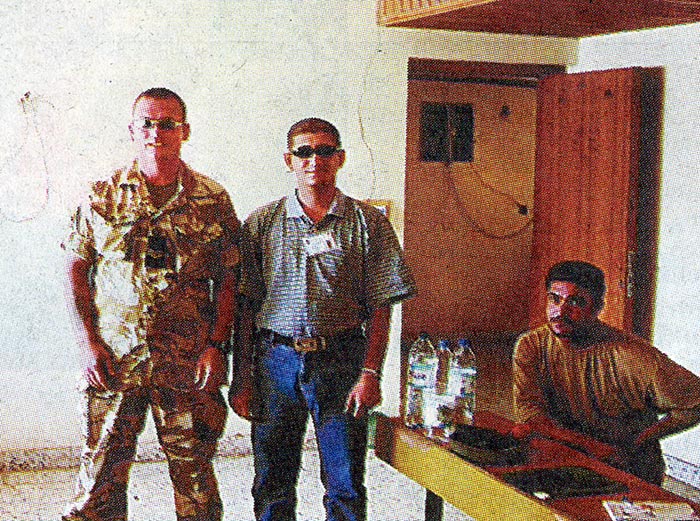 HEARTS AND MINDS... Sgt Elsom is seen with some of the locals...