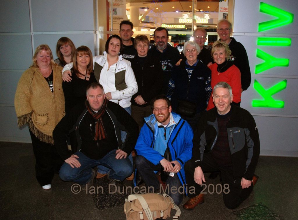 JOURNEY HOME... Ian Duncan, front centre, with the team at Kyiv airport before catching the flight back to the UK...