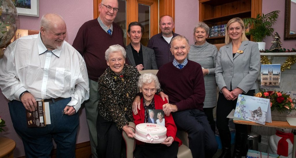 FAMILY CELEBRATION... Rena with friends and family as well as Deputy Provost Jackie Hendry (right) and her birthday cake...