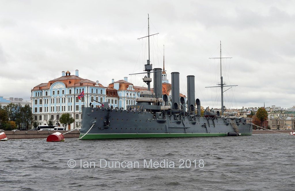CRUISE ON THE NEVA RIVER... The blue and white building is the naval school by the Cruiser Aurora where the blank shot was fired to signal the invasion of the Winter Palace and the start of the Russian Revolution...