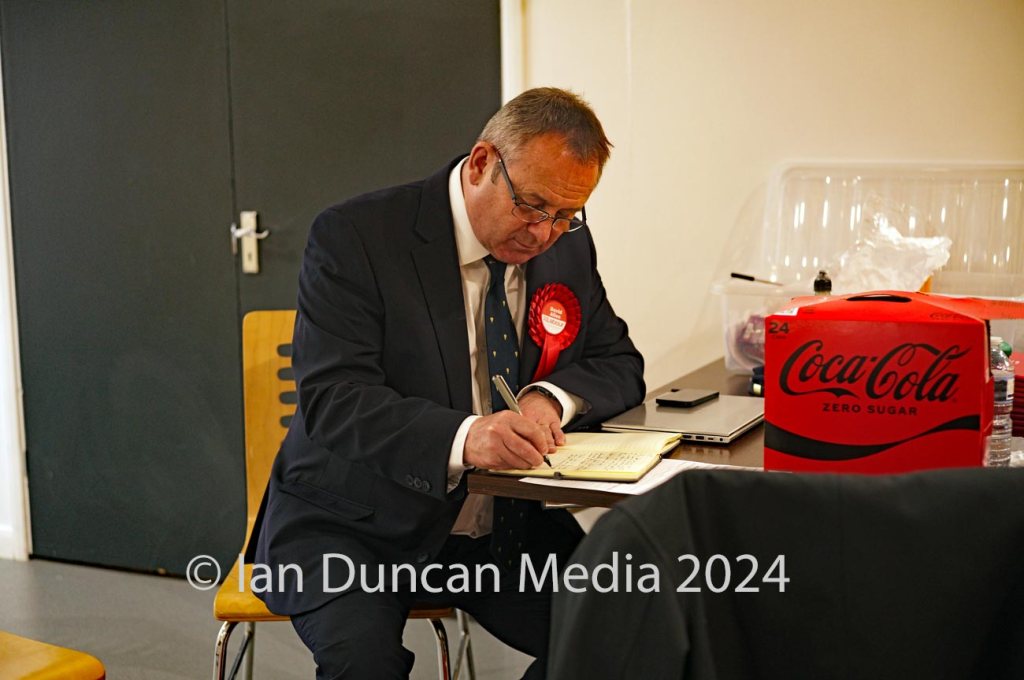 ACCEPTANCE SPEECH... Labour candidate David Allen jots down a few of his thoughts ahead of his acceptance speech after the official announcement...