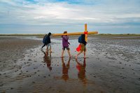 PILGRIMS' PROGRESS... Members of the annual Northern Cross pilgrimage arrive at the island of Lindisfarne after a week of trekking across the north of England...