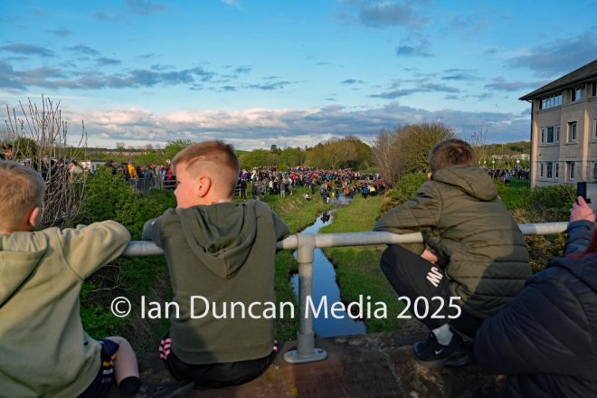 UPPIES AND DOWNIES... Kids watching the annual event in Workington on Easter Tuesday...