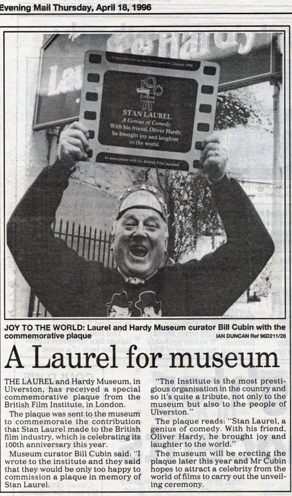 JOY TO THE WORLD... Laurel and Hardy Museum curator Bill Cubin with the commemorative plaque... Cutting from the North West Evening Mail on Thursday, April 18, 1996...