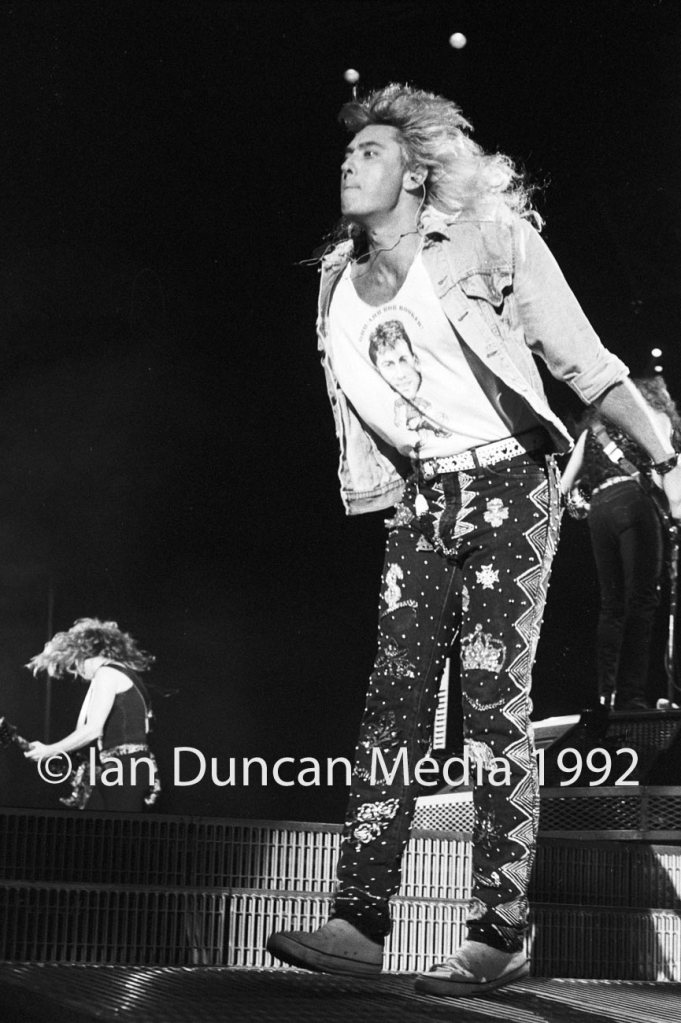 STRUTTING HIS STUFF... Def Leppard's Joe Elliott takes centre stage as the band, touring for the first time in three years, delight fans in their home city of Sheffield. Source: Ian Duncan.