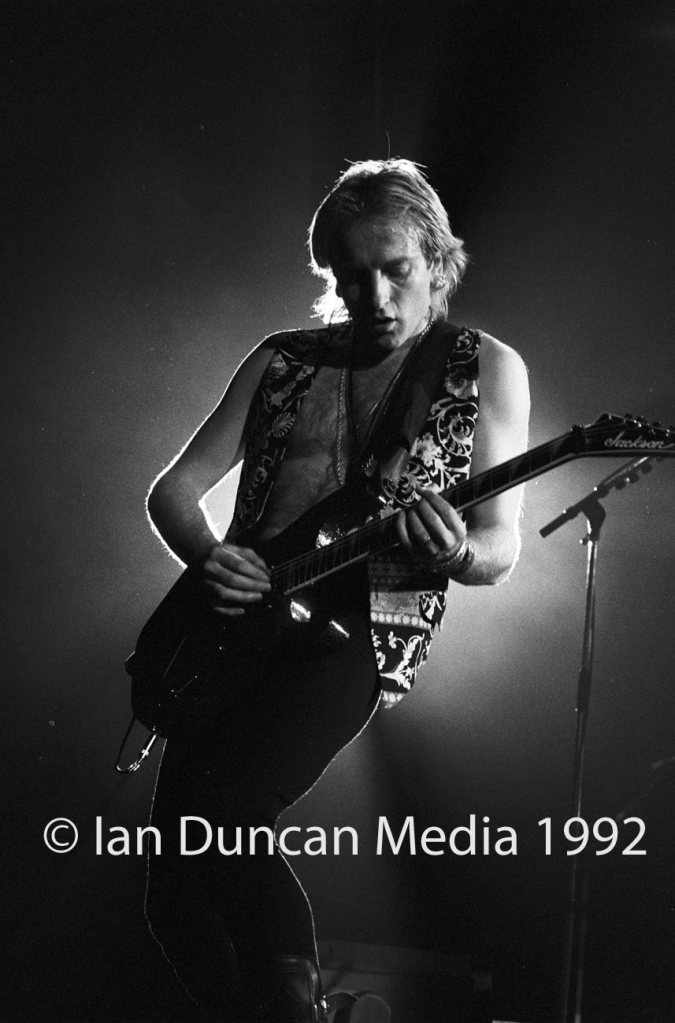 STRUTTING HIS STUFF... Def Leppard's Phil Collen takes centre stage as the band, touring for the first time in three years, delight fans in their home city of Sheffield. Source: Ian Duncan.