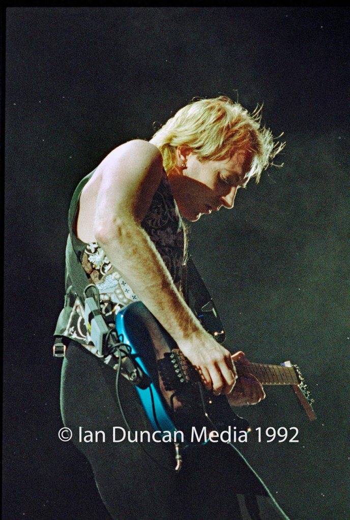 STRUTTING HIS STUFF... Def Leppard's Phil Collen takes centre stage as the band, touring for the first time in three years, delight fans in their home city of Sheffield. Source: Ian Duncan.