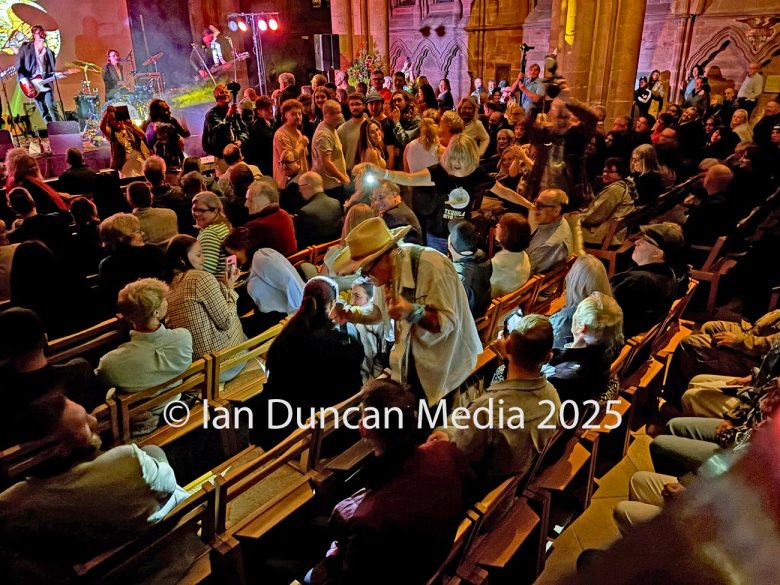 Joe ‘King’ Carrasco heading for the Carlisle Cathedral pulpit during a performance by Hardwicke Circus during A Night For Ukraine. Photo: Ian Duncan.