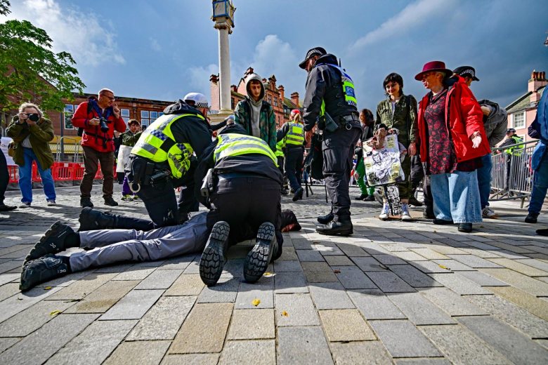 Me covering the arrest (pictured on the far left of the shot). Photo: Veronika Zolotoverkha.