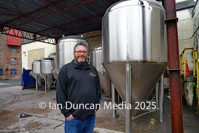 JENNINGS BREWERY... MD Chris France with the 11 new fermentation vessels...