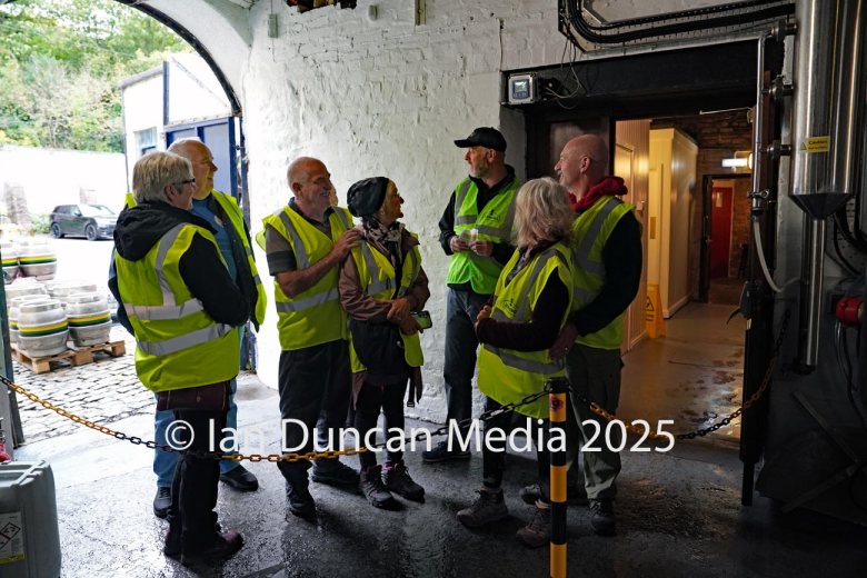 JENNINGS BREWERY... Tour guide Tom Speight, in cap, leads a tour of visitors around the site...