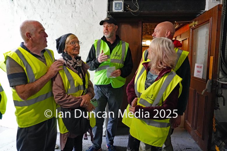 JENNINGS BREWERY... Tour guide Tom Speight, in cap, leads a tour of visitors around the site...
