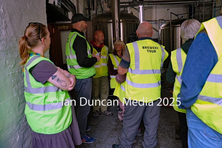 JENNINGS BREWERY... Tour guide Tom Speight, in cap, leads a tour of visitors around the site...