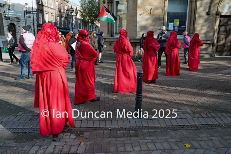 The Red Rebels, who are normally associated with Extinction Rebellion, perform in Carlisle to support the regular weekly vigil for Gaza and Palestine and raw a Red Line for Gaza following the recent peace deal. Picture: Ian Duncan.