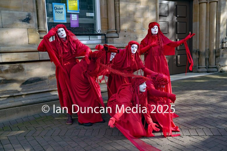 The Red Rebels, who are normally associated with Extinction Rebellion, perform in Carlisle to support the regular weekly vigil for Gaza and Palestine and raw a Red Line for Gaza following the recent peace deal. Picture: Ian Duncan.