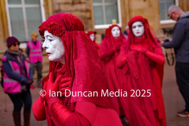 The Red Rebels, who are normally associated with Extinction Rebellion, perform in Carlisle to support the regular weekly vigil for Gaza and Palestine and raw a Red Line for Gaza following the recent peace deal. Picture: Ian Duncan.