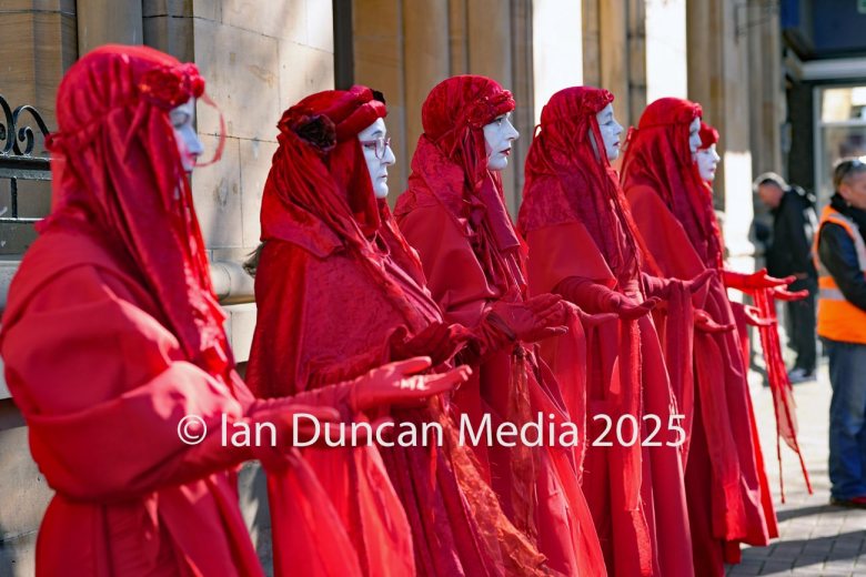 The Red Rebels, who are normally associated with Extinction Rebellion, perform in Carlisle to support the regular weekly vigil for Gaza and Palestine and raw a Red Line for Gaza following the recent peace deal. Picture: Ian Duncan.