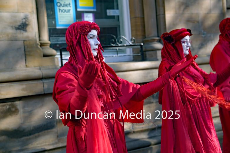 The Red Rebels, who are normally associated with Extinction Rebellion, perform in Carlisle to support the regular weekly vigil for Gaza and Palestine and raw a Red Line for Gaza following the recent peace deal. Picture: Ian Duncan.