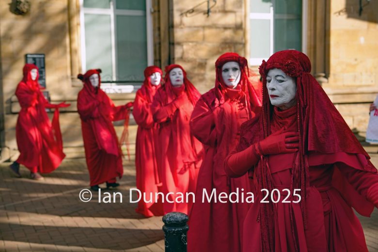 The Red Rebels, who are normally associated with Extinction Rebellion, perform in Carlisle to support the regular weekly vigil for Gaza and Palestine and raw a Red Line for Gaza following the recent peace deal. Picture: Ian Duncan.